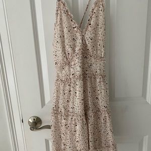 Brand new printed dress with cross strap detail in back